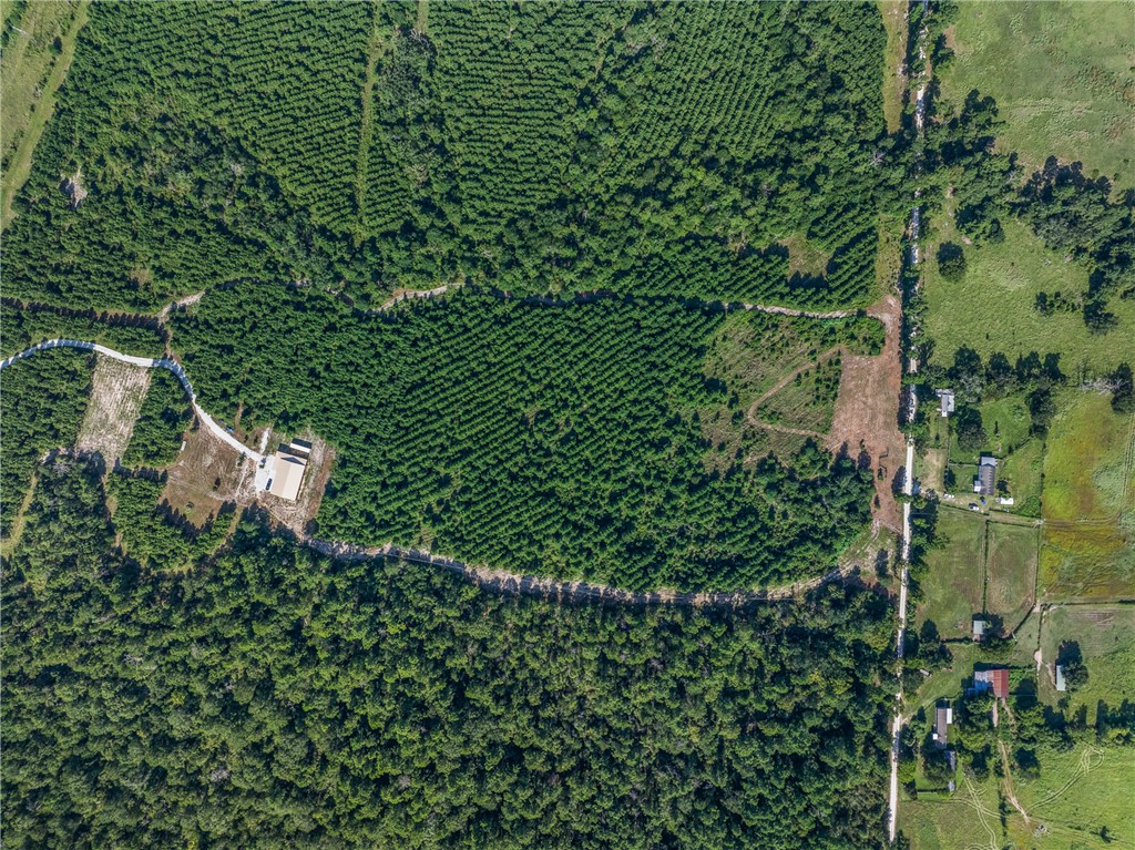 109 Old Sign Road, Unit COUNTYROAD Midway, TX 75852 - Photo 21 of 33 an aerial view of a house with a yard