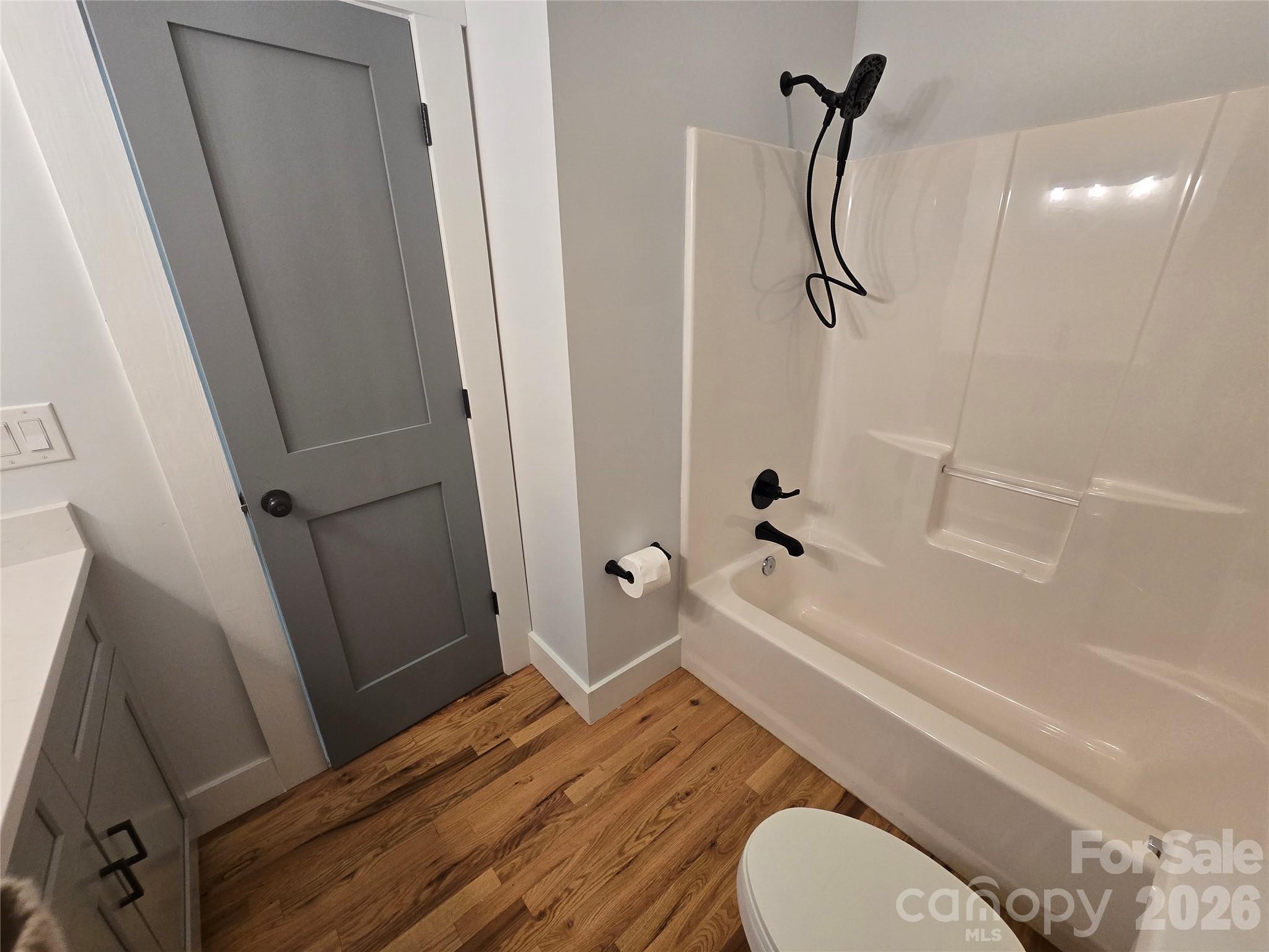 6802 Lowesville Lane Stanley, NC 28164 - Photo 18 of 25 a bathroom with a sink a toilet and shower