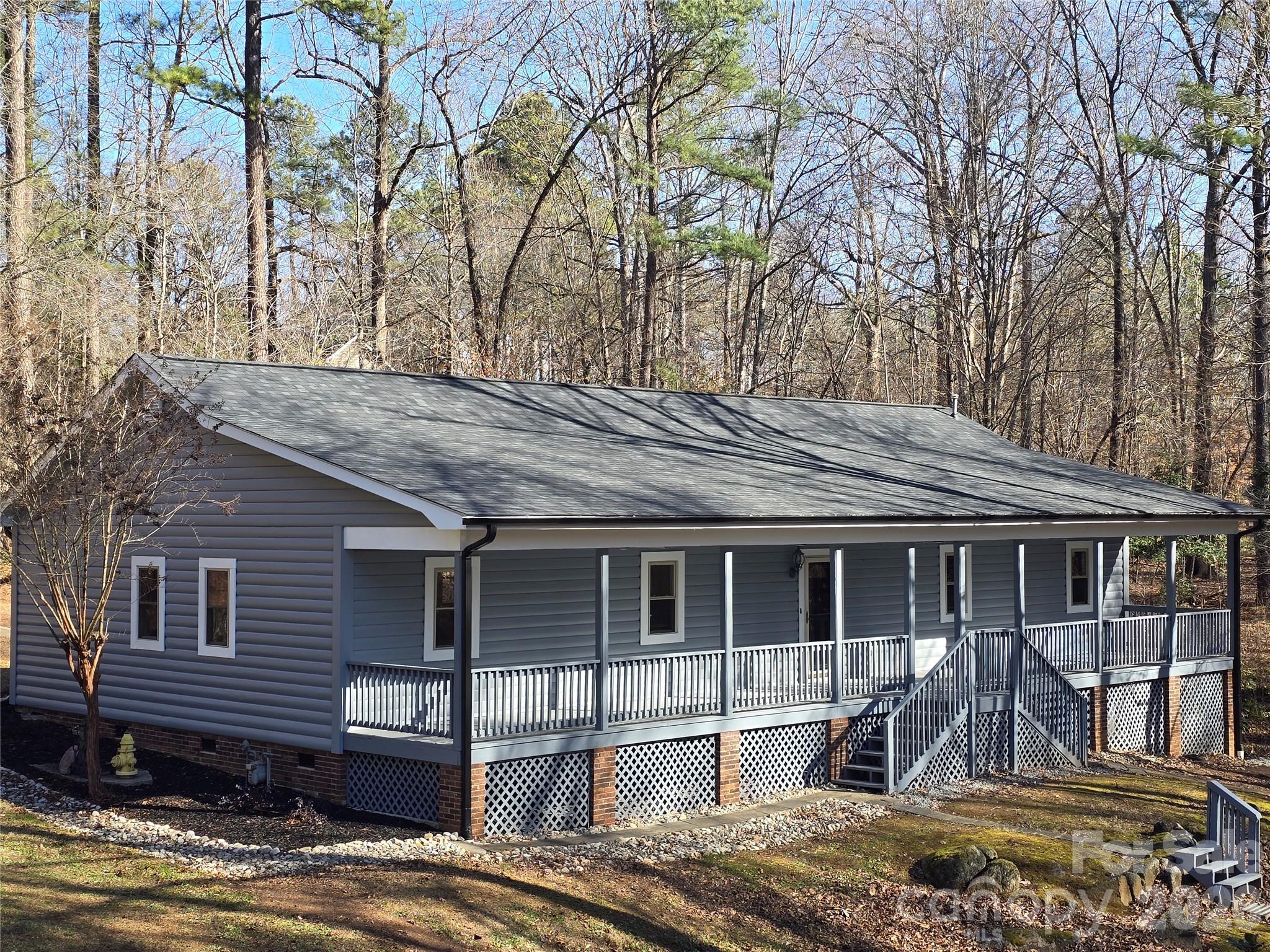 6802 Lowesville Lane Stanley, NC 28164 - Photo 2 of 25 a front view of a house with a yard