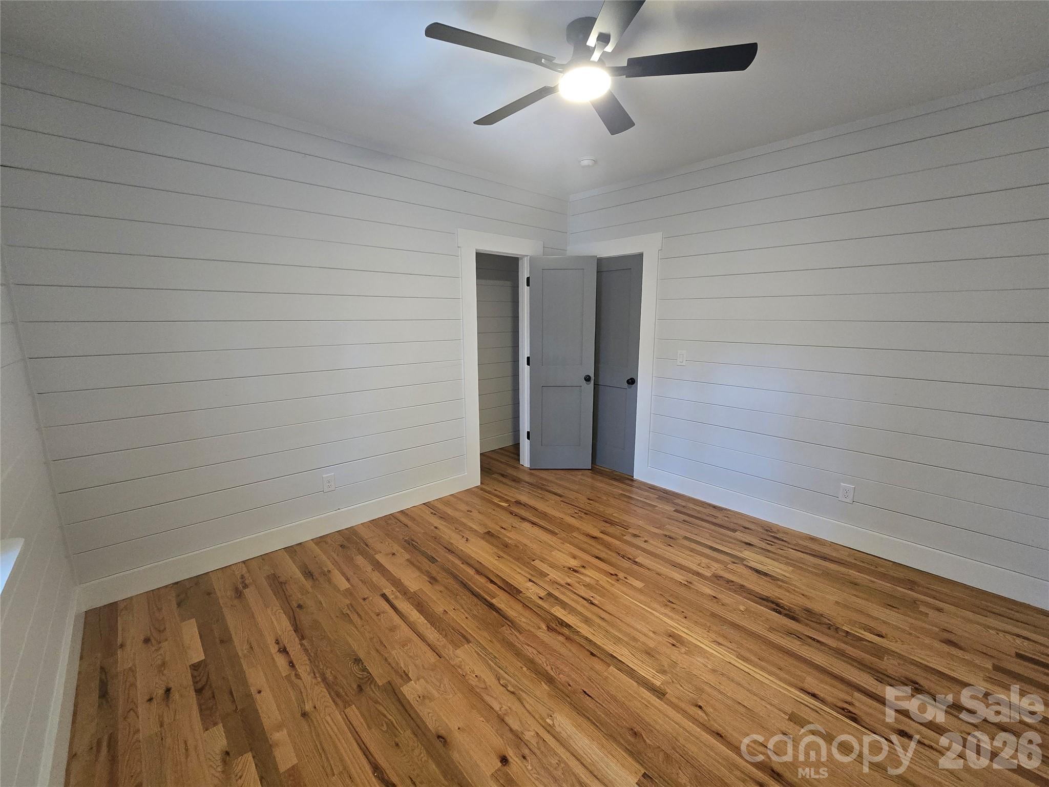 6802 Lowesville Lane Stanley, NC 28164 - Photo 22 of 25 a view of empty room with wooden floor