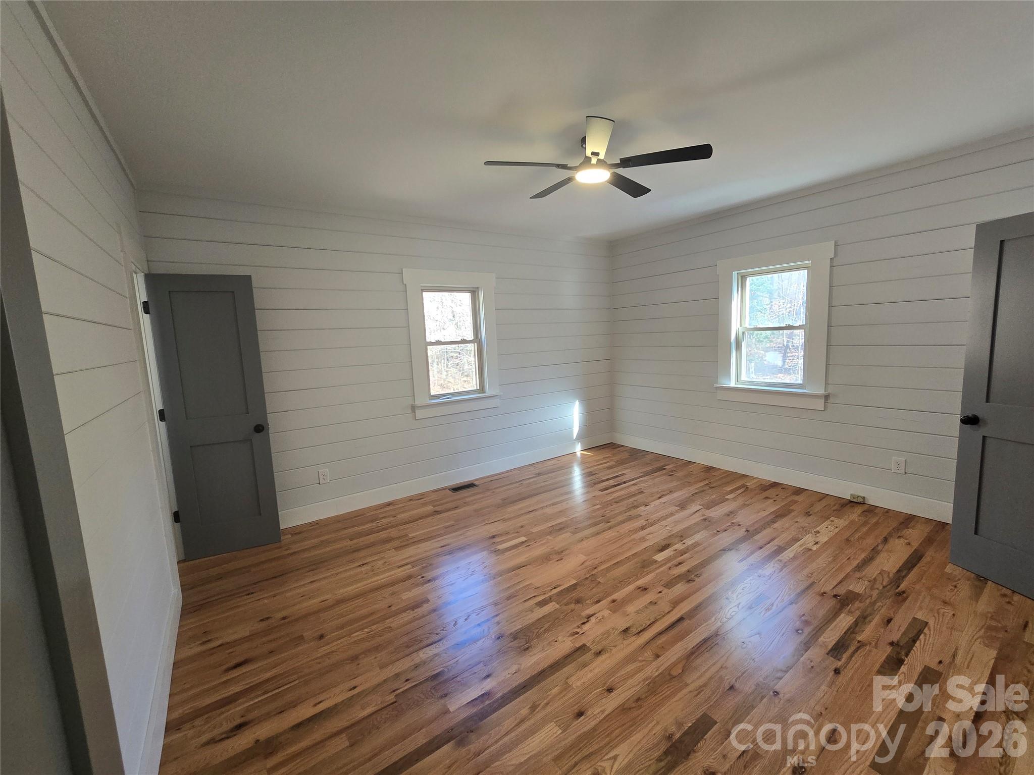 6802 Lowesville Lane Stanley, NC 28164 - Photo 23 of 25 a view of an empty room with wooden floor and a window