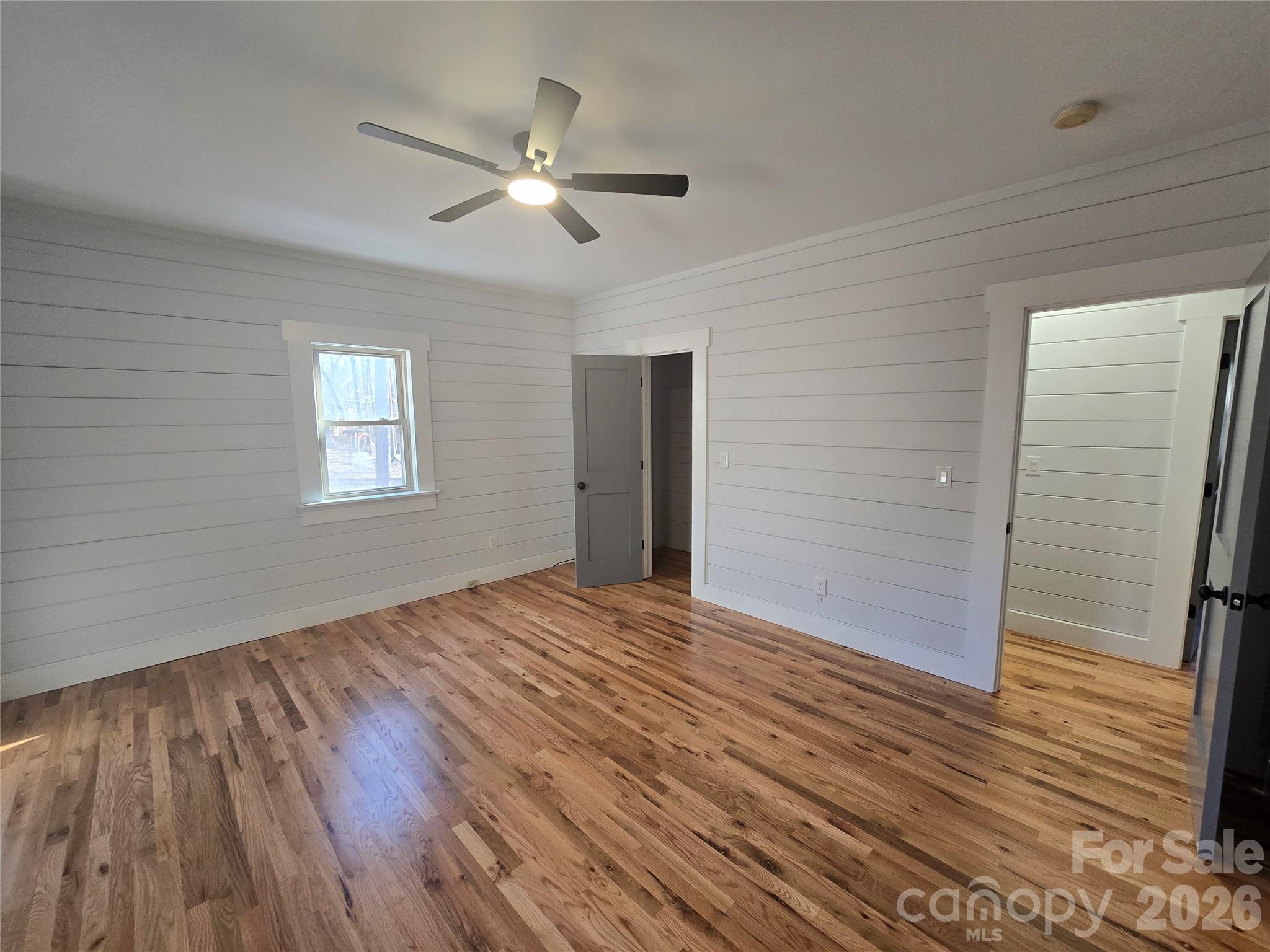 6802 Lowesville Lane Stanley, NC 28164 - Photo 24 of 25 a view of an empty room with wooden floor and a window