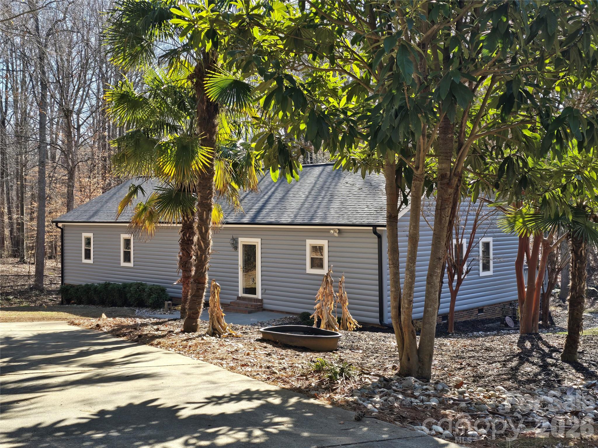 6802 Lowesville Lane Stanley, NC 28164 - Photo 4 of 25 a front view of a house with a yard