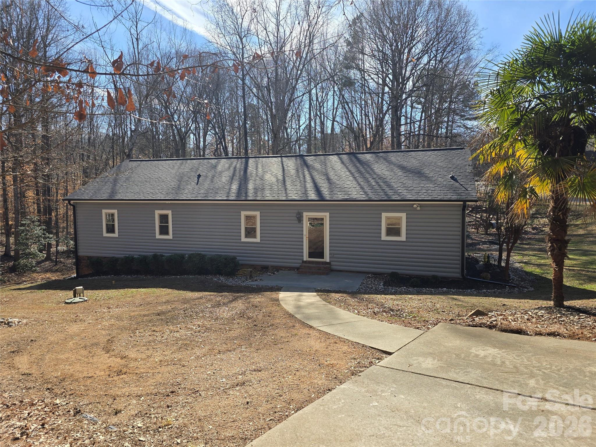 6802 Lowesville Lane Stanley, NC 28164 - Photo 5 of 25 a front view of a house with a yard