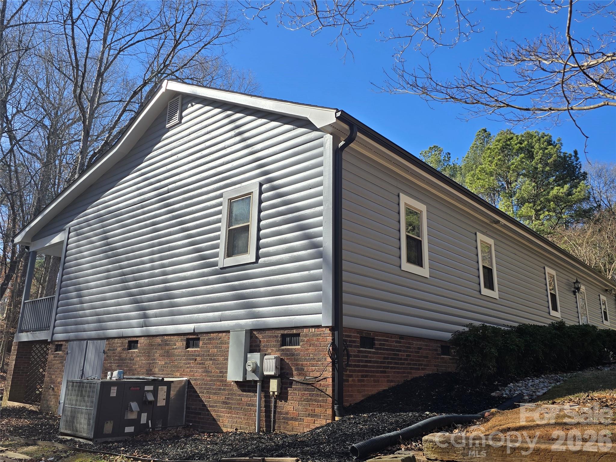 6802 Lowesville Lane Stanley, NC 28164 - Photo 6 of 25 a view of a house with a patio