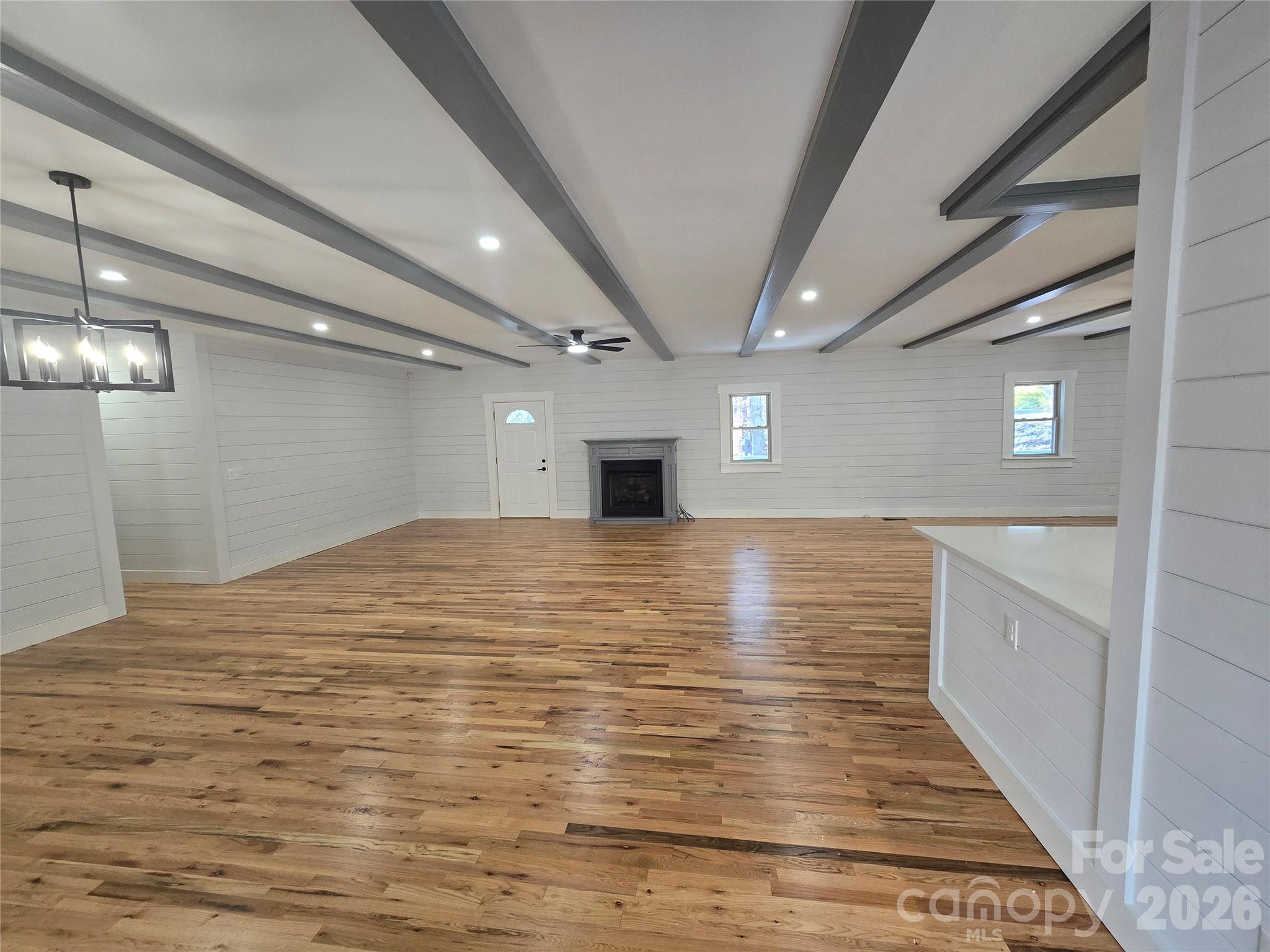 6802 Lowesville Lane Stanley, NC 28164 - Photo 8 of 25 a view of empty room with wooden floor