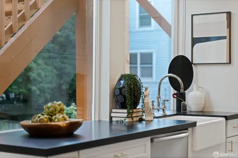 a view of balcony with wooden floor and outdoor seating