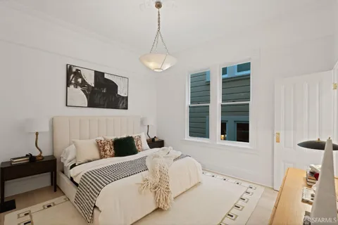 a view of a chairs and table in a backyard