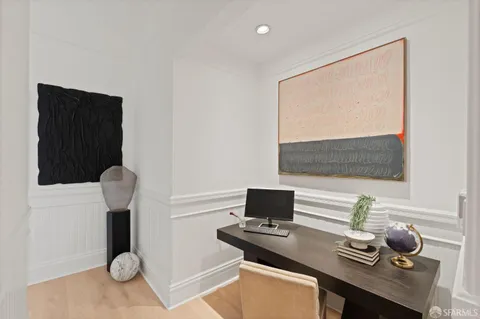 a table with a vase and flowers on it