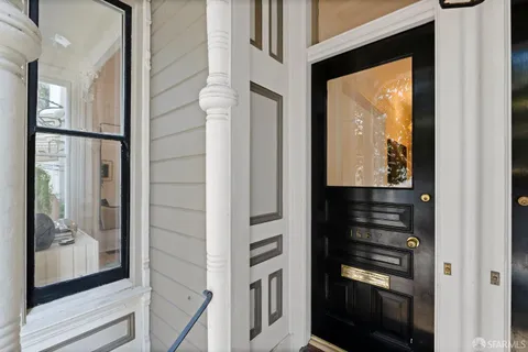 a kitchen with granite countertop a sink stove and cabinets