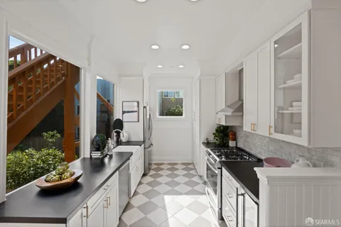 a bathroom with a bath tub sink mirror and a shower