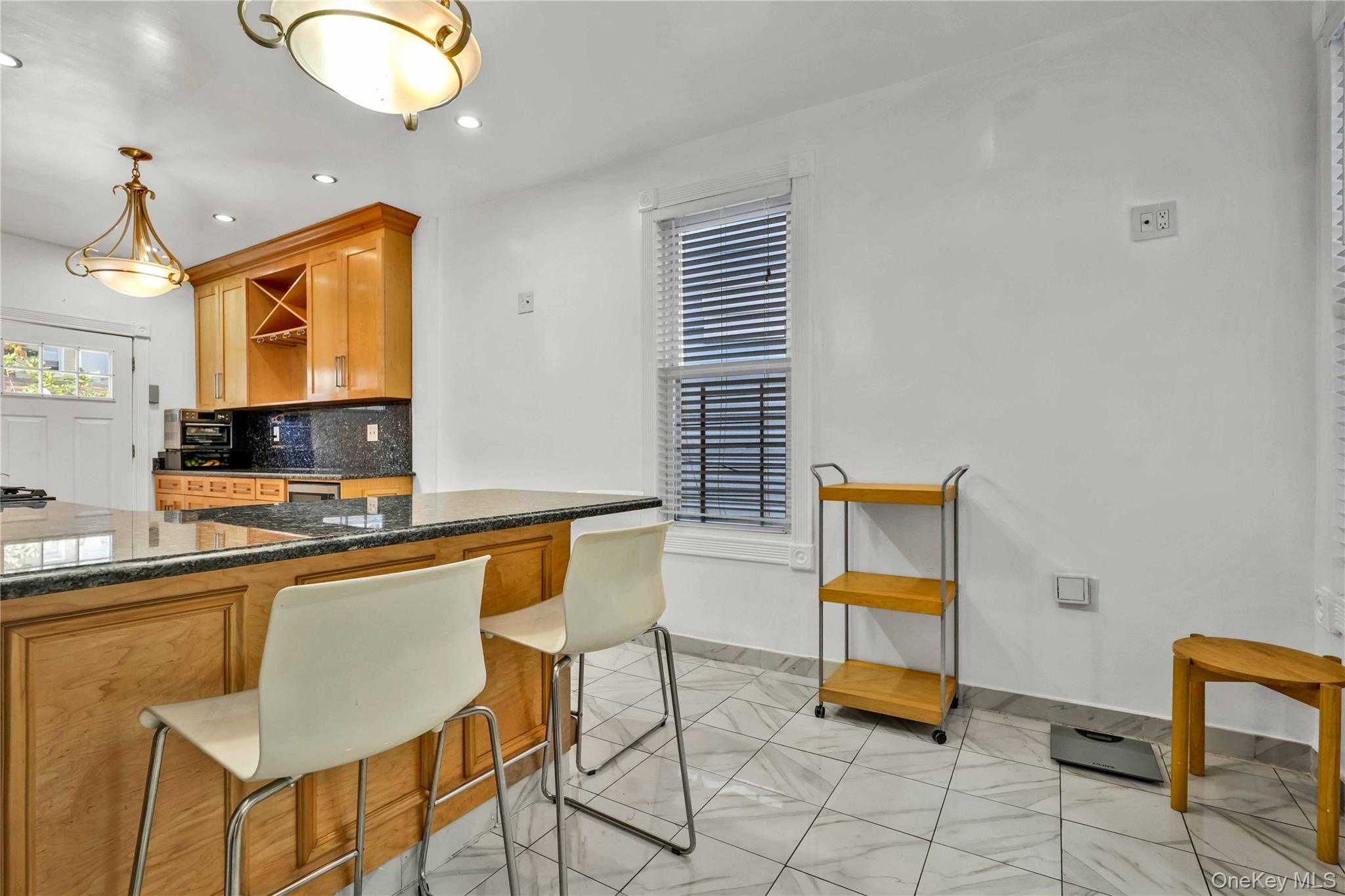 80-63 87th Road Queens, NY 11421 - Photo 13 of 37 a kitchen with a sink cabinets and window