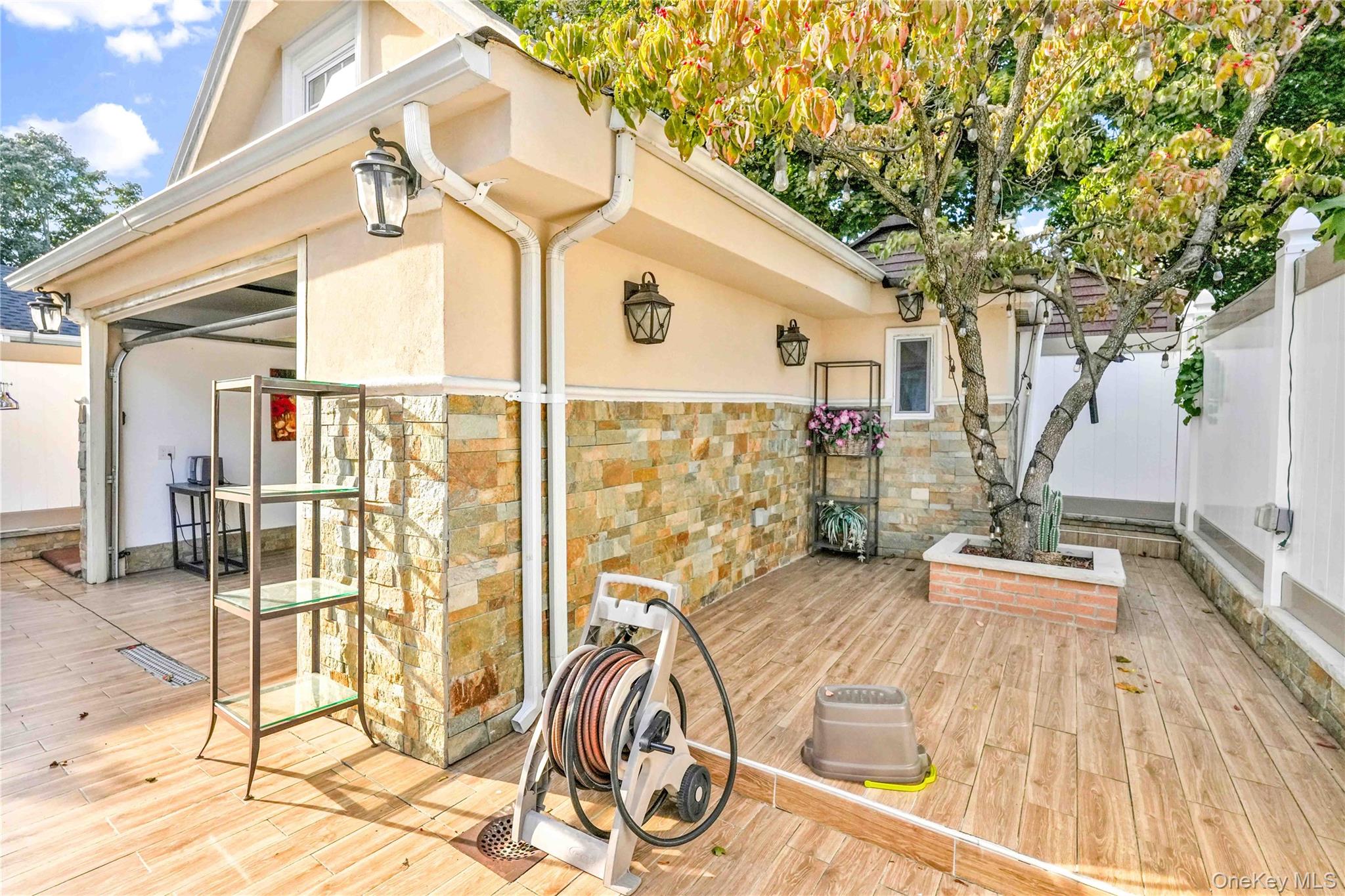 80-63 87th Road Queens, NY 11421 - Photo 7 of 37 a view of a house with a patio