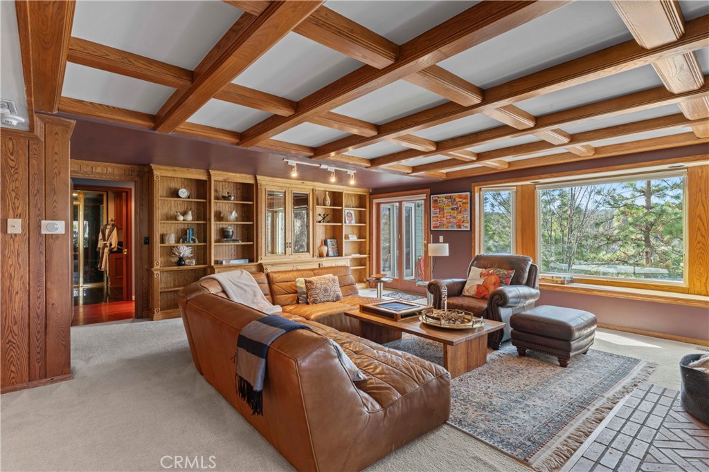 28019 North Shore Road Lake Arrowhead, CA 92352 - Photo 14 of 30 a living room with furniture and large windows