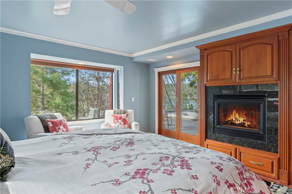 28019 North Shore Road Lake Arrowhead, CA 92352 - Photo 18 of 30 a bedroom with a bed and wooden floor