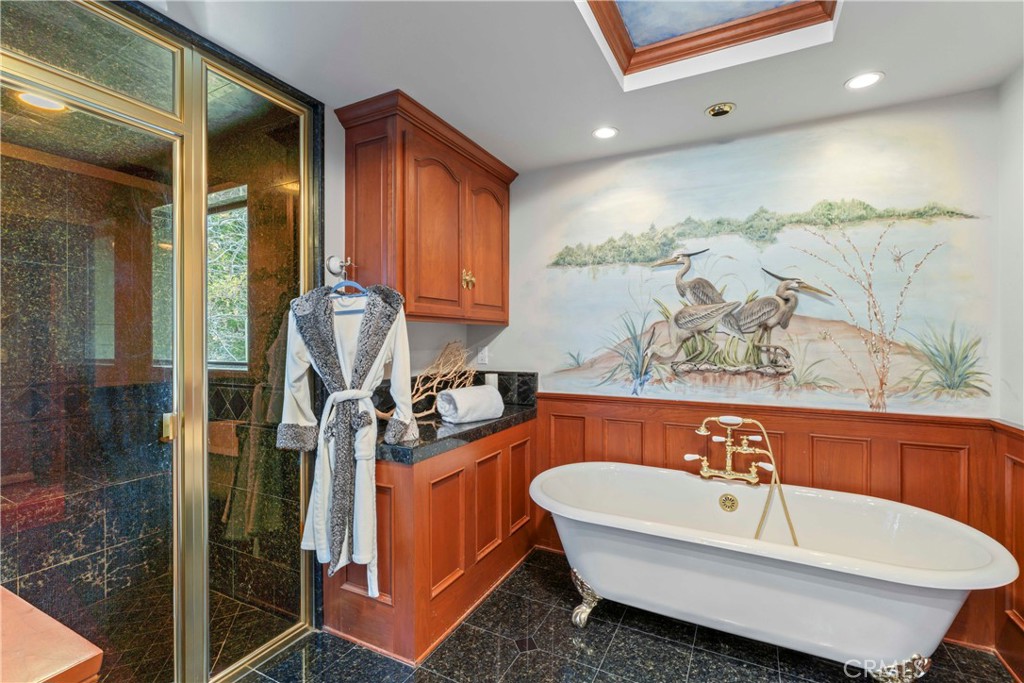 28019 North Shore Road Lake Arrowhead, CA 92352 - Photo 19 of 30 a bathroom with a sink and a bathtub