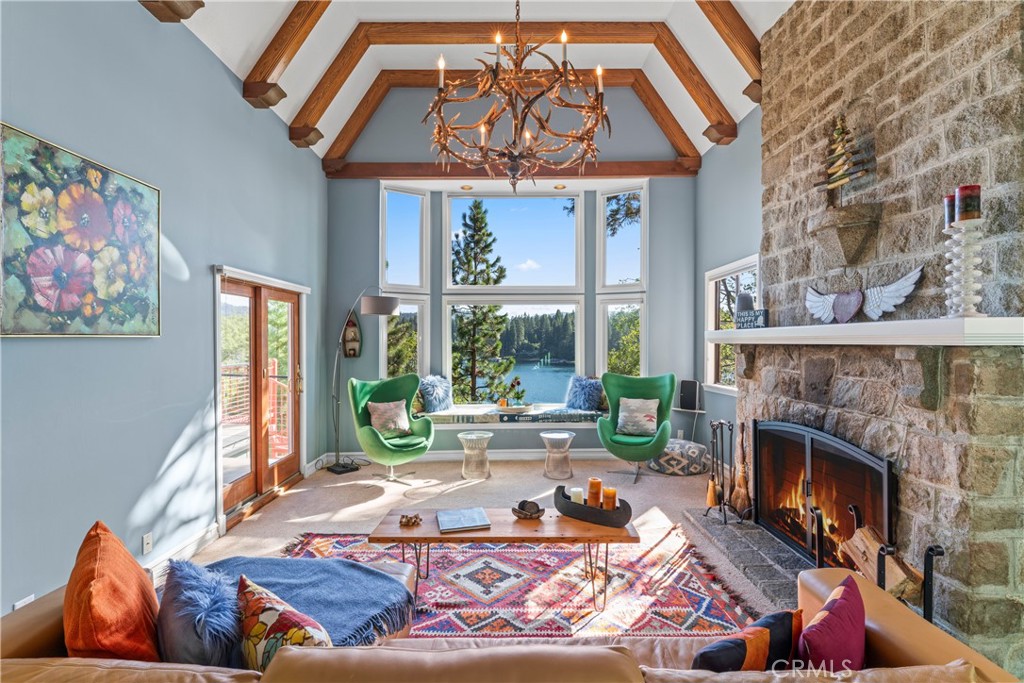 28019 North Shore Road Lake Arrowhead, CA 92352 - Photo 3 of 30 a living room with furniture and a fireplace