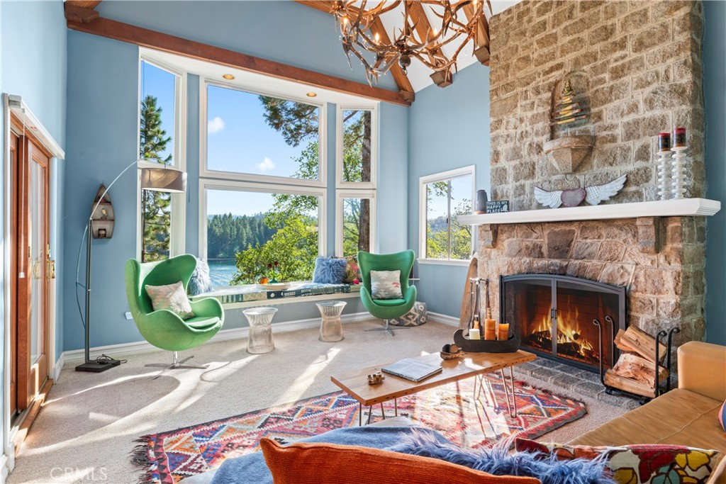 28019 North Shore Road Lake Arrowhead, CA 92352 - Photo 4 of 30 a living room with furniture and a fireplace