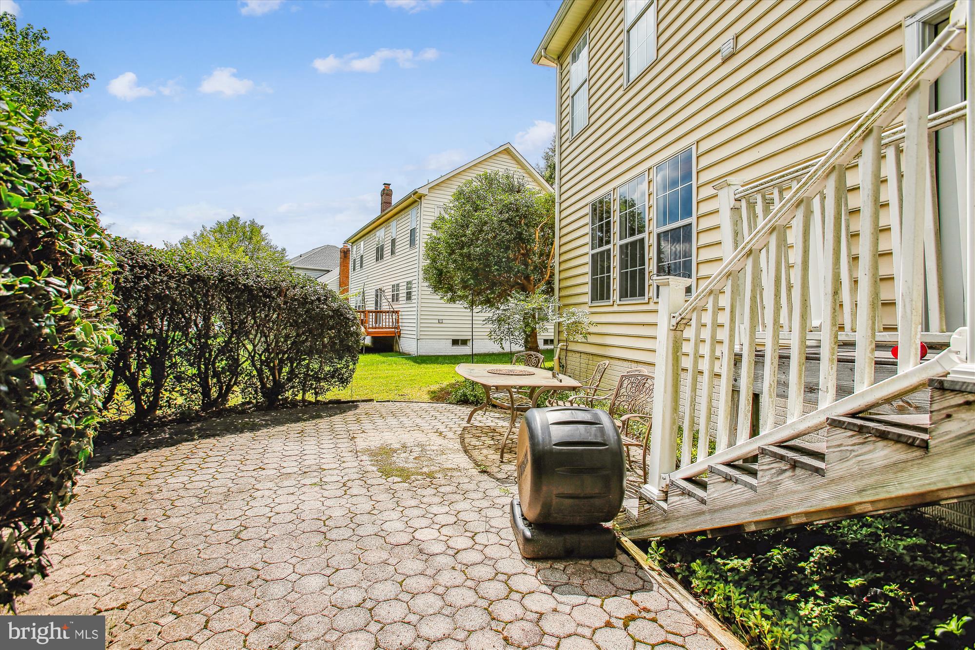 2303 Hurlingham Lane Reston, VA 20191 - Photo 2 of 8 a view of a house with backyard and sitting area