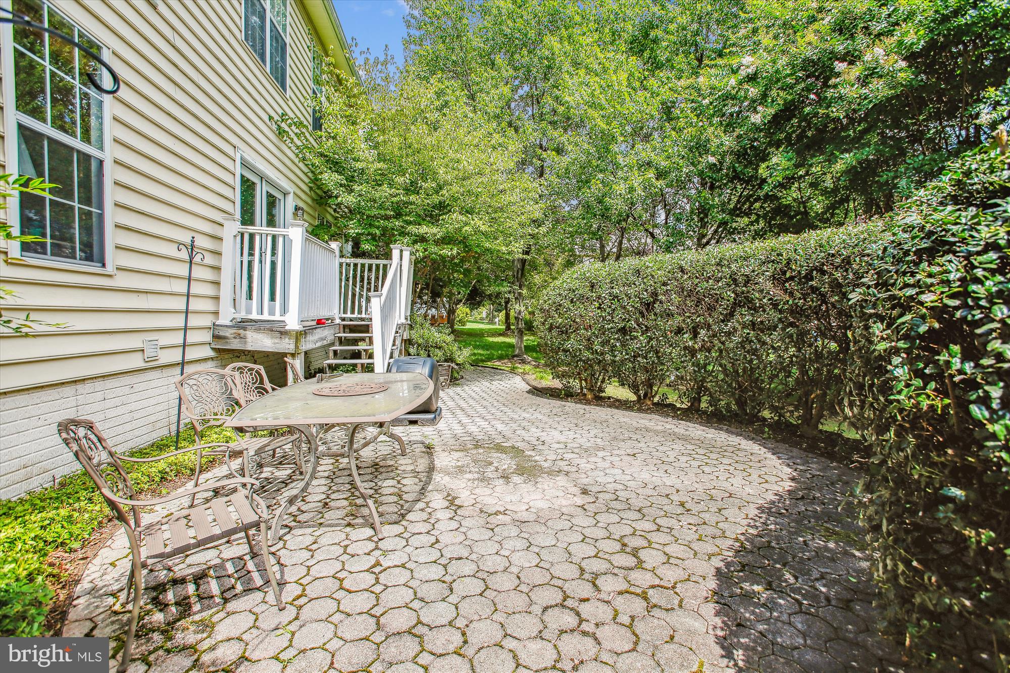 2303 Hurlingham Lane Reston, VA 20191 - Photo 3 of 8 a view of backyard with a table and chairs