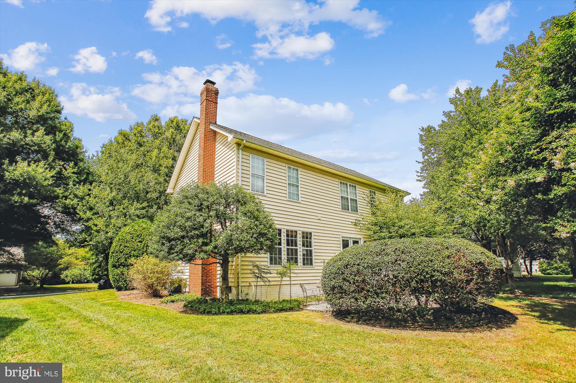 2303 Hurlingham Lane Reston, VA 20191 - Photo 4 of 8 a front view of a house with a yard
