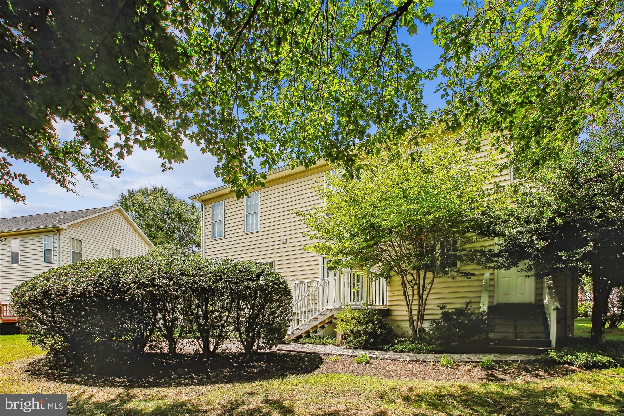 2303 Hurlingham Lane Reston, VA 20191 - Photo 7 of 8 a view of a house with a yard