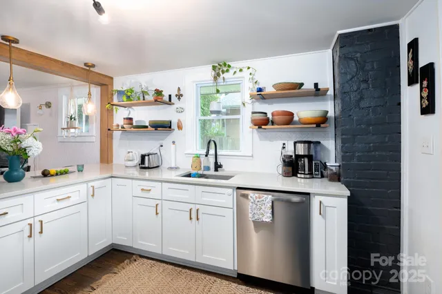 a kitchen with cabinets and window