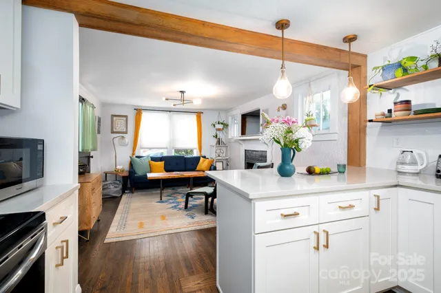 a kitchen with a white appliances a sink and cabinets