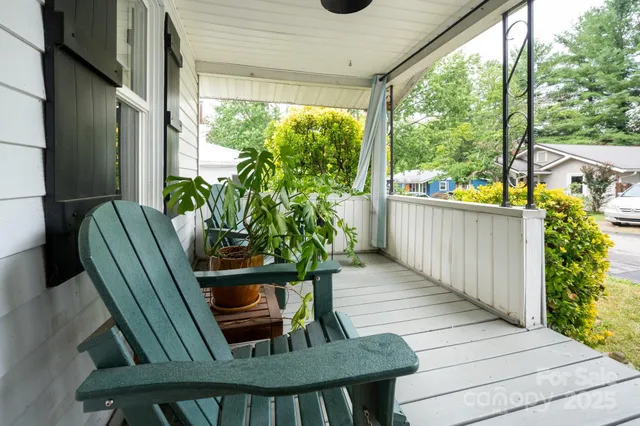 a view of balcony with furniture