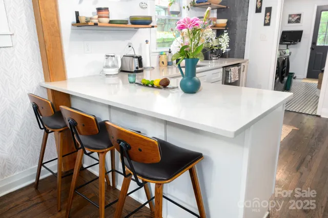 a kitchen with a table and chairs in it