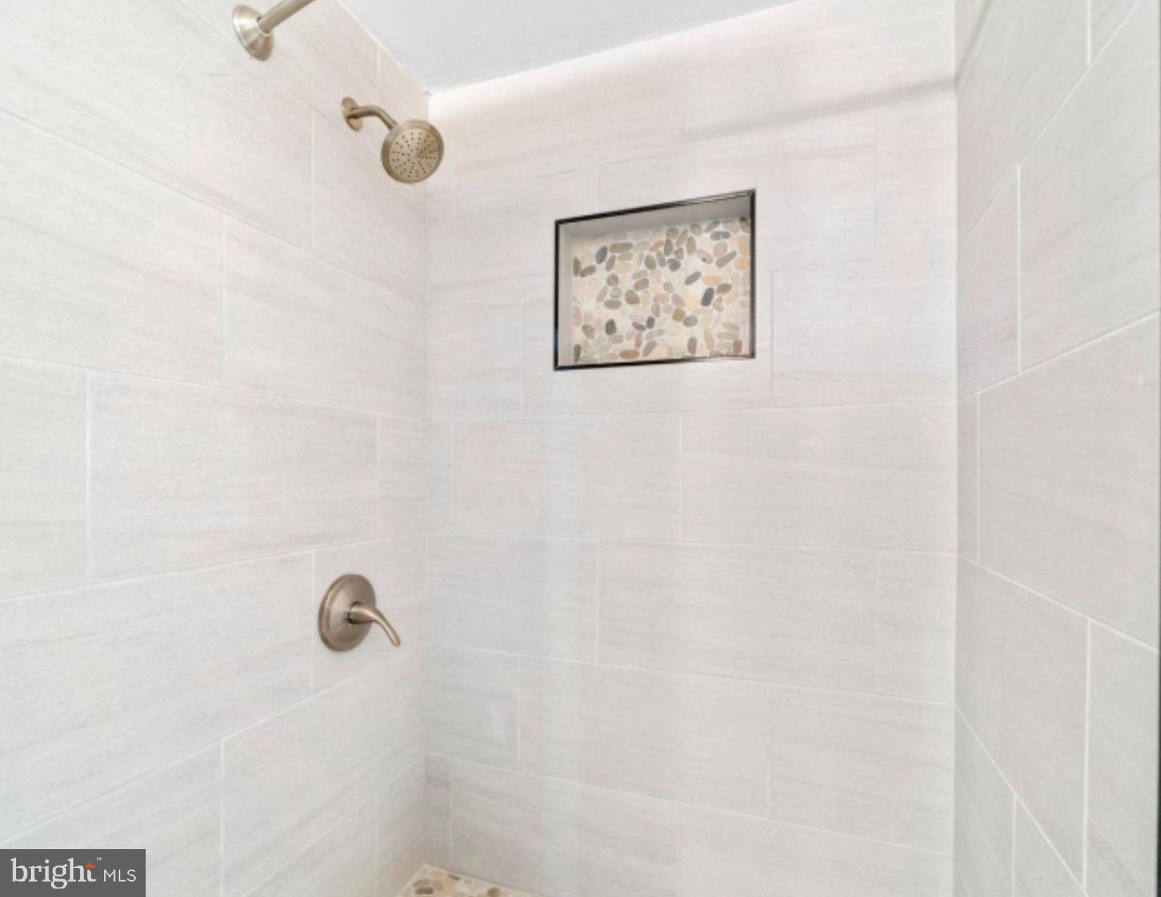 3020 North Calvert Street Baltimore, MD 21218 - Photo 12 of 13 Sleek, modern shower with elegant finishes.