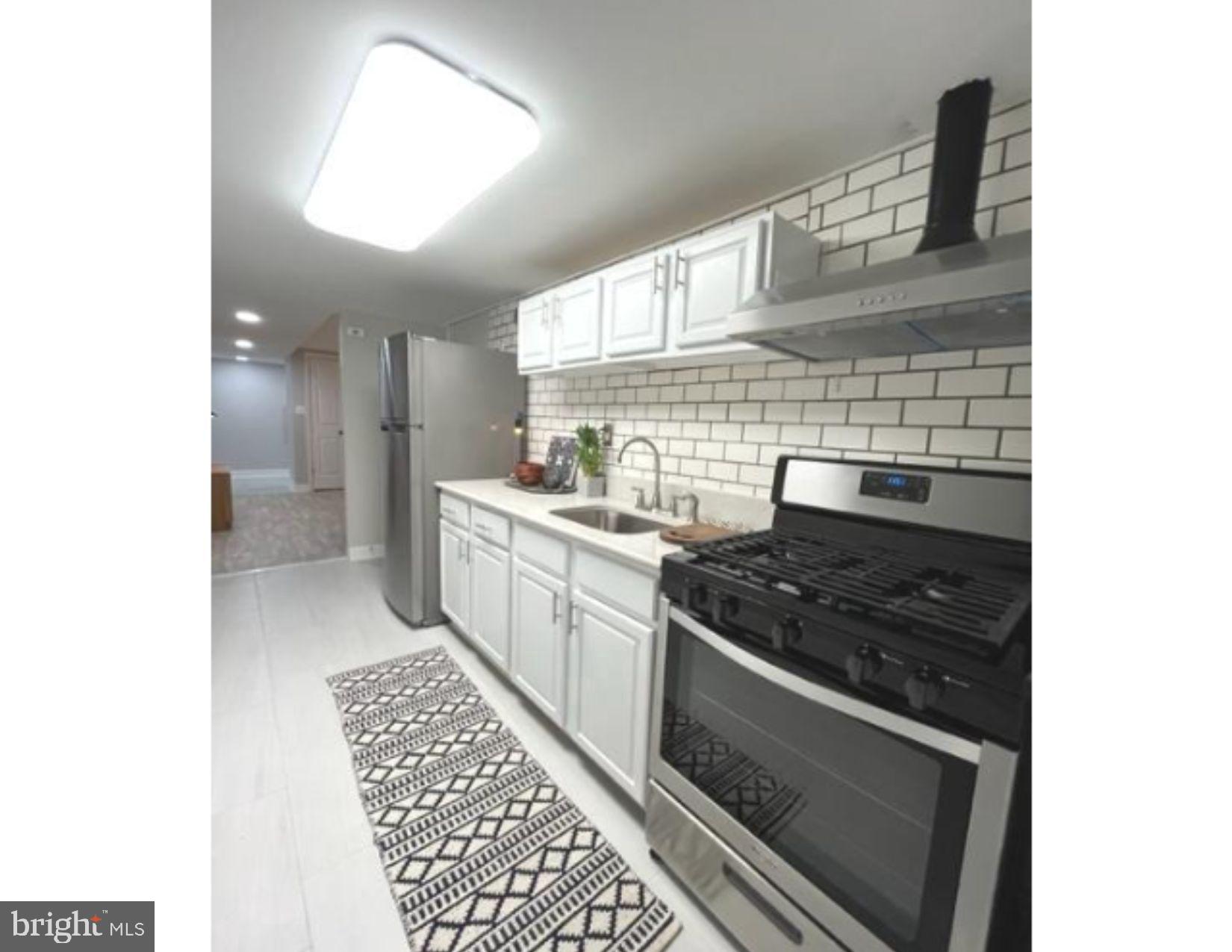 3020 North Calvert Street Baltimore, MD 21218 - Photo 8 of 13 Modern kitchen with sleek finishes.