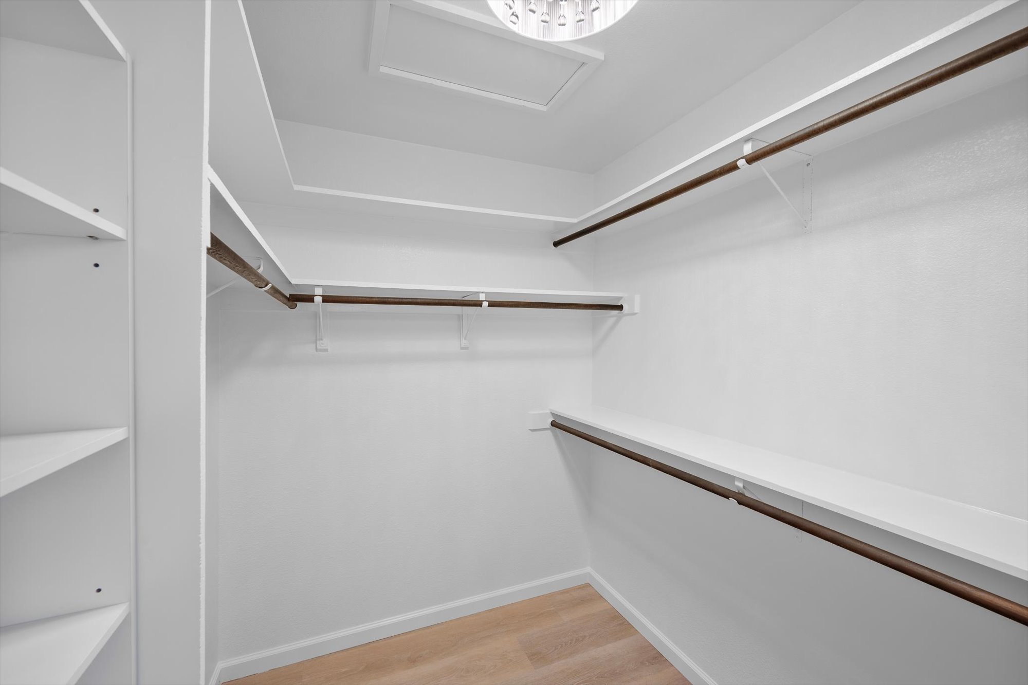 109 Woodland Road Georgetown, TX 78628 - Photo 27 of 40 Ample shelving and hanging space defines this well-organized walk-in closet.