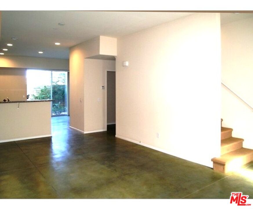 228 Sandy Point Trail Palm Springs, CA 92262 - Photo 12 of 12 a view of an empty room with wooden floor