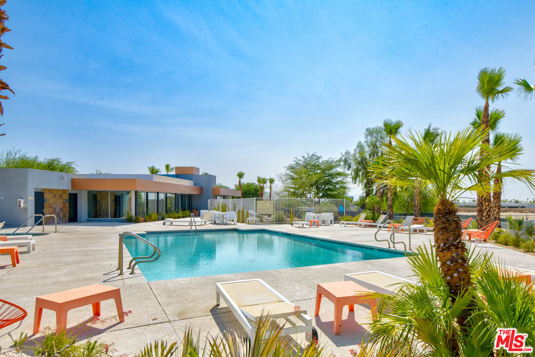 228 Sandy Point Trail Palm Springs, CA 92262 - Photo 6 of 12 a view of a swimming pool with a patio