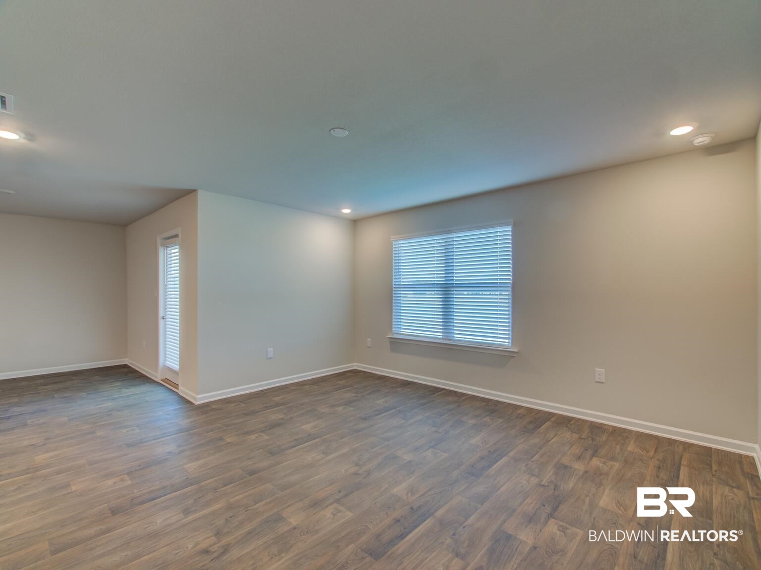 23952 Citation Loop Daphne, AL 36526 - Photo 9 of 69 Empty room with recessed lighting and dark wood-style flooring