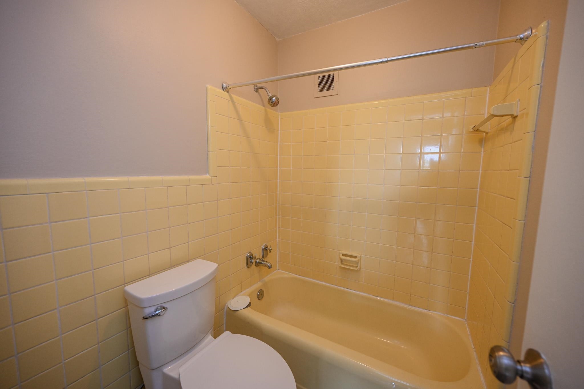 2277 Union Avenue, Unit 408 Memphis, TN 38104 - Photo 12 of 31 a bathroom with a shower and a toilet