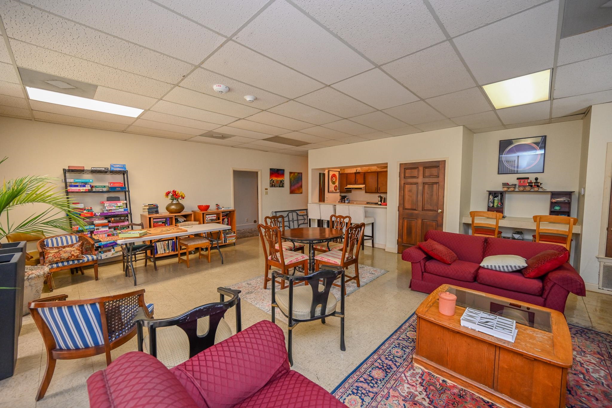 2277 Union Avenue, Unit 408 Memphis, TN 38104 - Photo 21 of 31 a living room with furniture kitchen view and a wooden floor