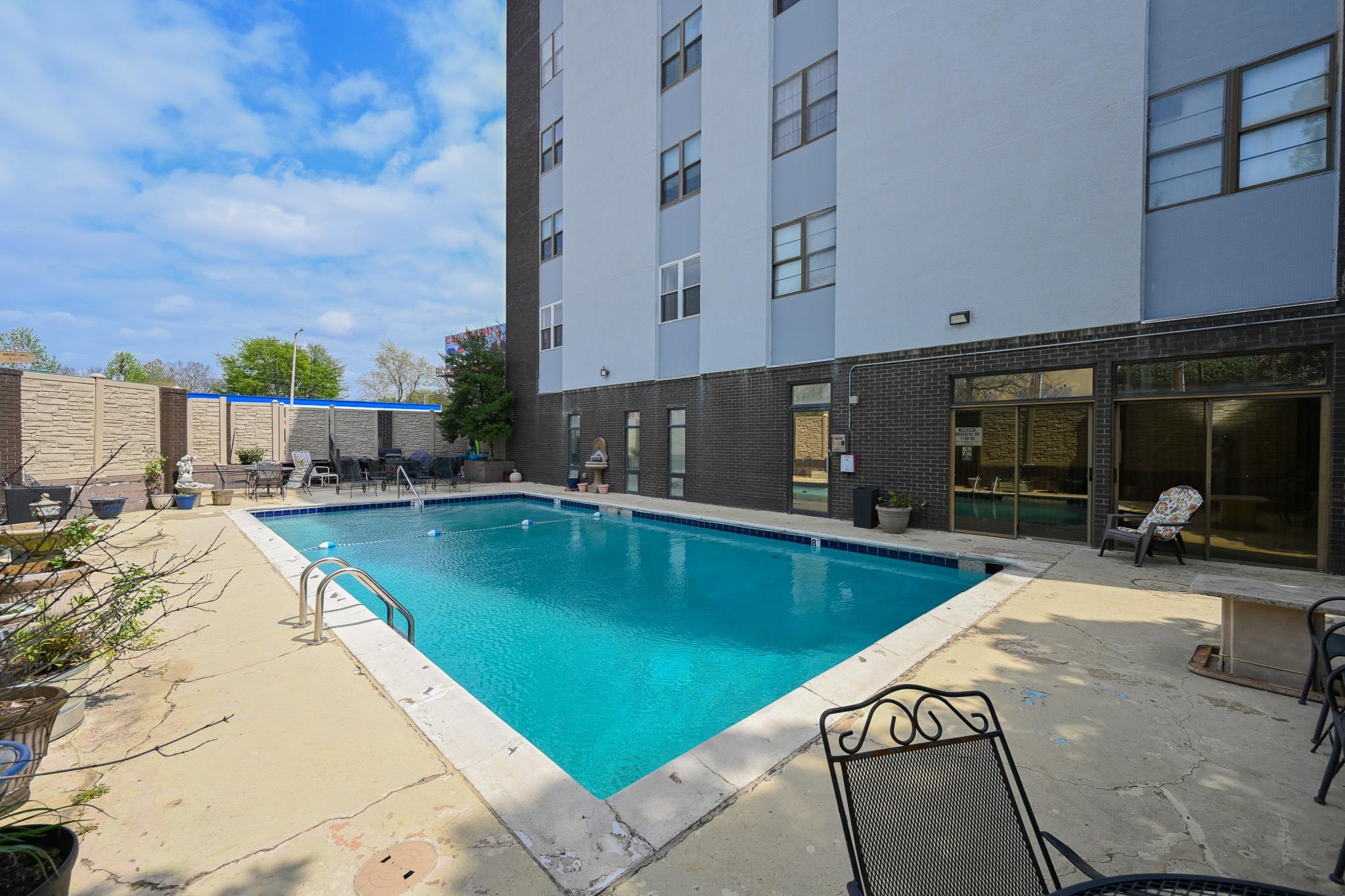 2277 Union Avenue, Unit 408 Memphis, TN 38104 - Photo 26 of 31 a view of a swimming pool with sitting area