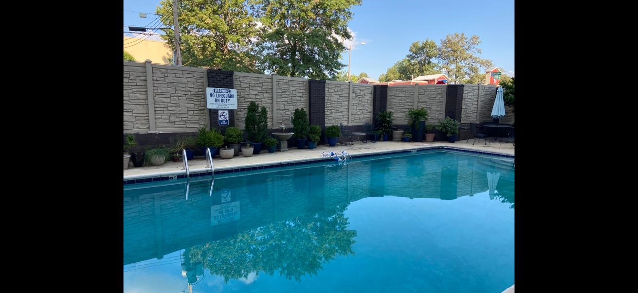 2277 Union Avenue, Unit 408 Memphis, TN 38104 - Photo 30 of 31 a view of house with swimming pool and outdoor seating