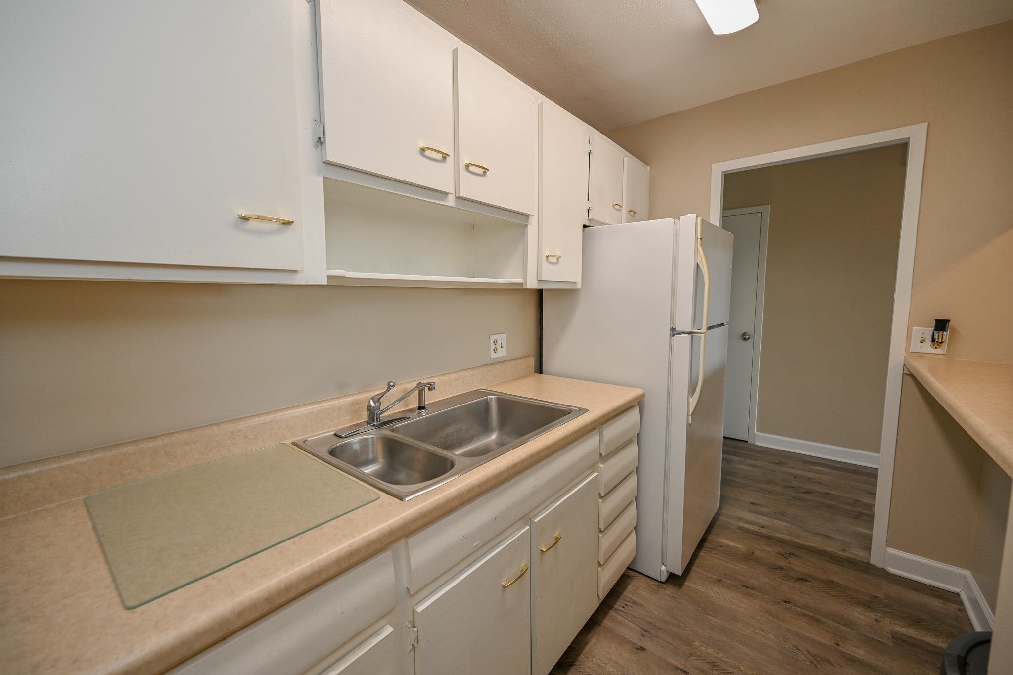 2277 Union Avenue, Unit 408 Memphis, TN 38104 - Photo 6 of 31 a kitchen with a sink and refrigerator