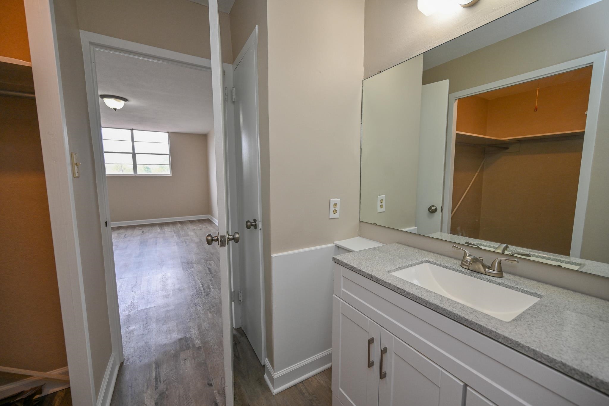 2277 Union Avenue, Unit 408 Memphis, TN 38104 - Photo 10 of 31 a bathroom with a sink and a mirror