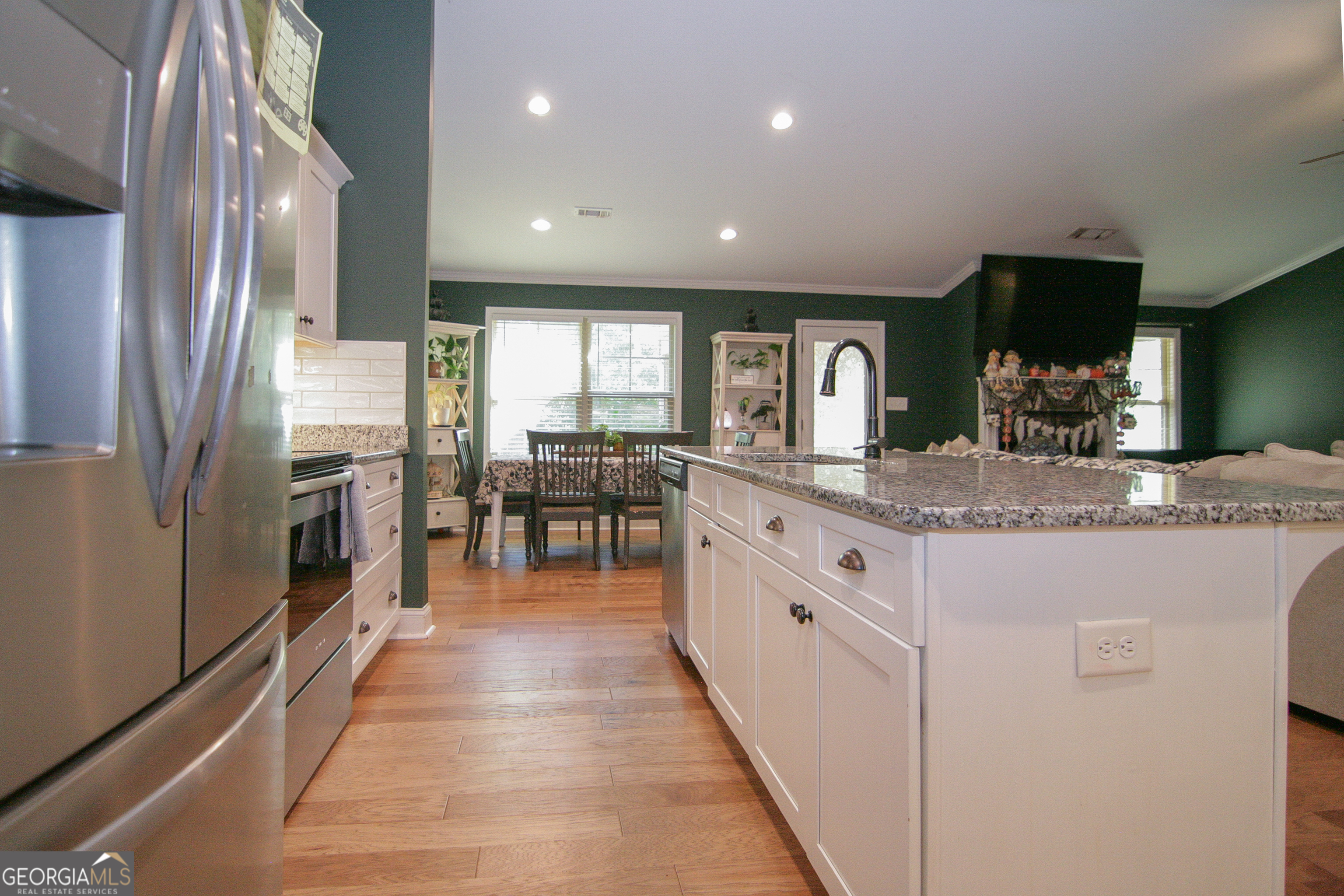 4282 Highway 29 Moreland, GA 30259 - Photo 44 of 60 a kitchen with stainless steel appliances granite countertop counter space a sink refrigerator and cabinets
