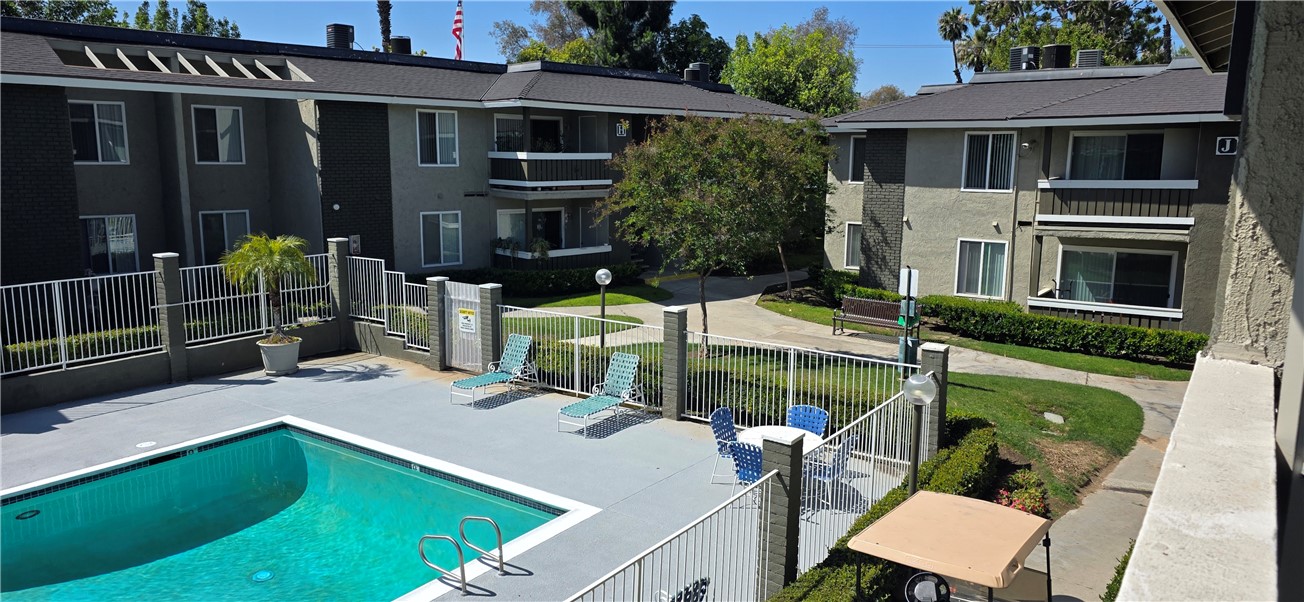 10601 Diana Avenue, Unit 408 Riverside, CA 92505 - Photo 9 of 10 a view of an house with backyard space and balcony