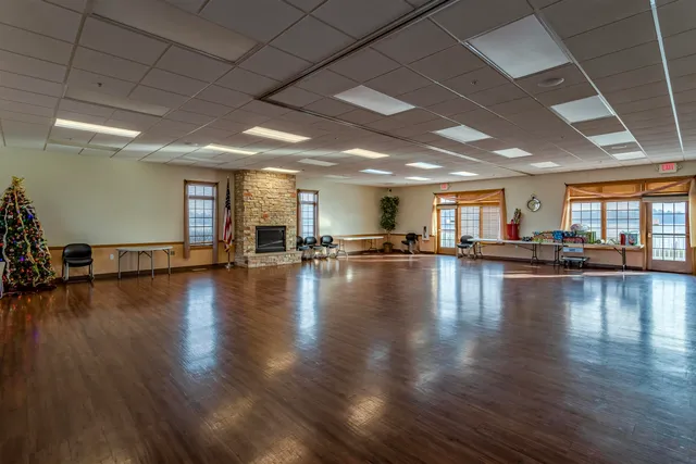 a view of a room with lots of wooden furniture