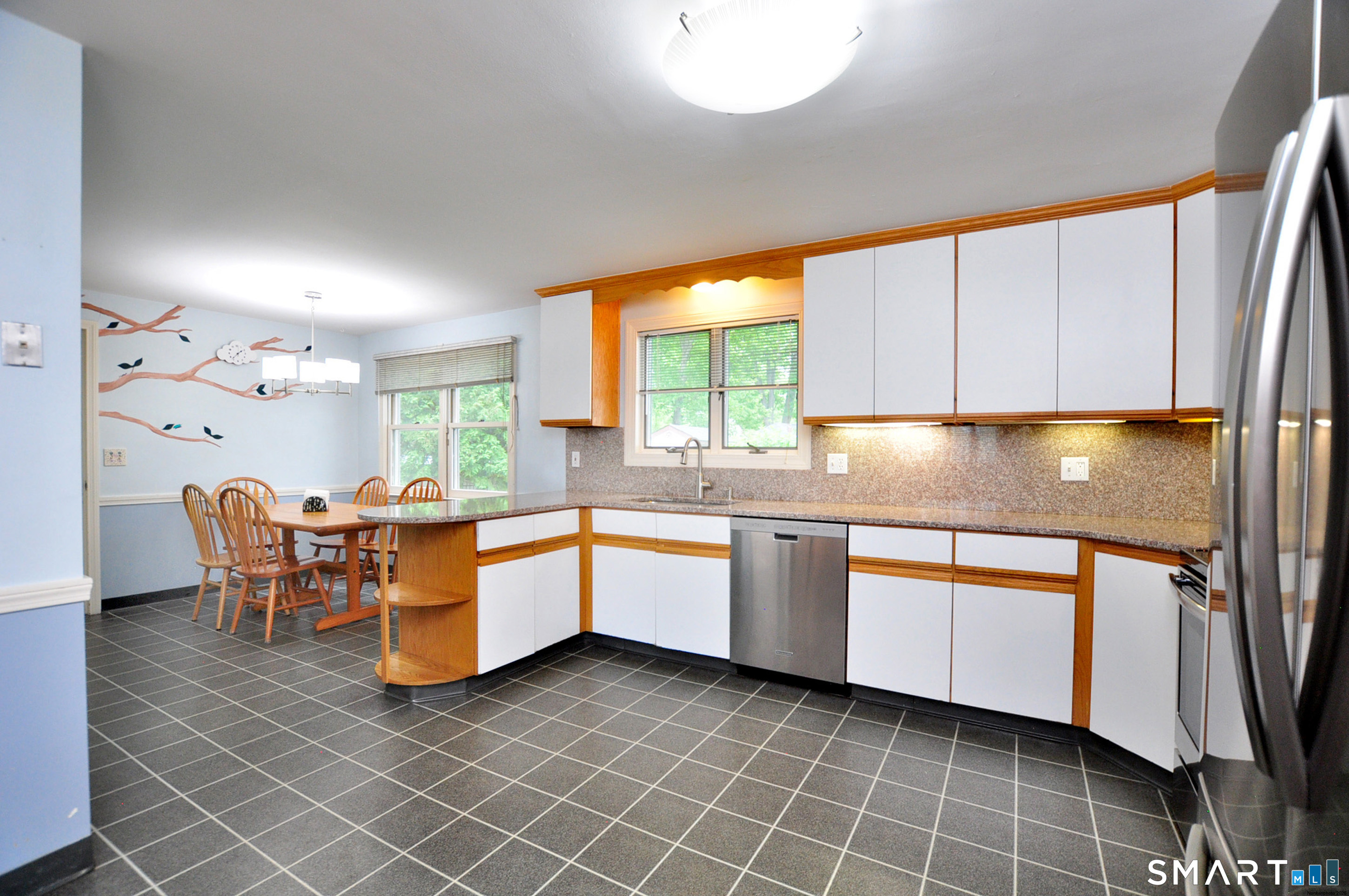 44 Miamis Road West Hartford, CT 06117 - Photo 13 of 39 a kitchen with stainless steel appliances granite countertop a sink and cabinets