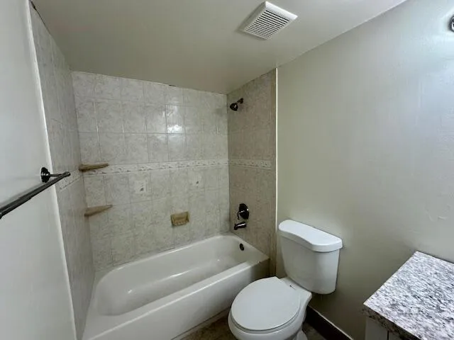 a view of a chairs and table in the patio