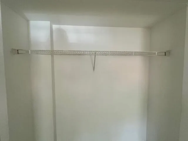 a front view of a house with a yard and fountain