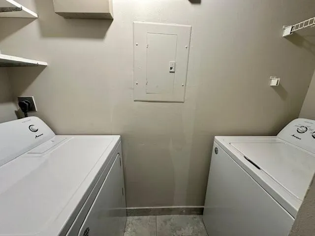 a view of a room with window and hardwood floor