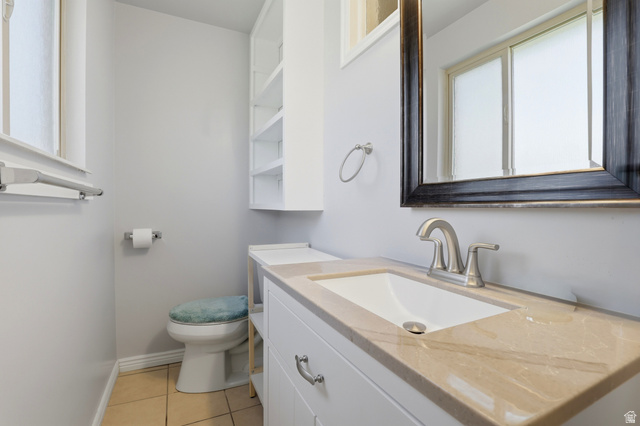 4245 3320 East Holladay, UT 84124 - Photo 30 of 51 Bathroom vanity featuring a light-colored countertop, an undermount sink, and a brushed nickel faucet